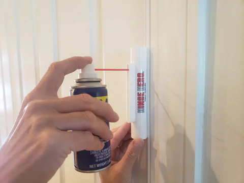 lubricating the self-closing door hinge